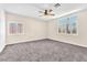 Bedroom with a ceiling fan, carpet floors and a large window at 1088 Casady Hollow Ave, Henderson, NV 89012