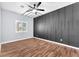 This empty bedroom features wood floors and a ceiling fan at 1088 Casady Hollow Ave, Henderson, NV 89012