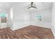 Bedroom with hardwood floors, large window and wainscoting at 1088 Casady Hollow Ave, Henderson, NV 89012