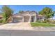 Charming single-story home with a well-manicured lawn and a three-car garage at 1088 Casady Hollow Ave, Henderson, NV 89012