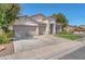 Charming stucco home featuring a three-car garage and meticulously maintained landscaping at 1088 Casady Hollow Ave, Henderson, NV 89012