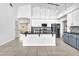 Bright kitchen with two-tone cabinetry, granite counters, stainless appliances and stylish pendant lighting at 1088 Casady Hollow Ave, Henderson, NV 89012