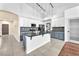 Bright kitchen with two-tone cabinetry, granite counters, stainless appliances and stylish pendant lighting at 1088 Casady Hollow Ave, Henderson, NV 89012