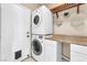 Efficient laundry room features stacked washer and dryer, and a countertop with storage at 1088 Casady Hollow Ave, Henderson, NV 89012