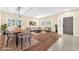 Open-concept living room with dining area, featuring stylish decor and plenty of natural light at 1088 Casady Hollow Ave, Henderson, NV 89012