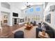 Inviting living room with vaulted ceiling, modern fireplace, and ample seating at 1088 Casady Hollow Ave, Henderson, NV 89012