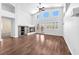 Bright living room with vaulted ceiling, modern fireplace, and expansive windows at 1088 Casady Hollow Ave, Henderson, NV 89012