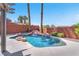 Inviting pool area showcases a custom waterfall feature and serene outdoor relaxation space at 1088 Casady Hollow Ave, Henderson, NV 89012