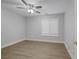 This bedroom features a ceiling fan, window with shutters, and neutral paint at 11158 Antonine Wall Ct, Las Vegas, NV 89141