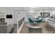 View of the dining area with table and chairs, adjacent to a living area with fireplace at 11158 Antonine Wall Ct, Las Vegas, NV 89141