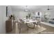 Modern dining area with a stylish table, vaulted ceilings, and chic decor at 11158 Antonine Wall Ct, Las Vegas, NV 89141