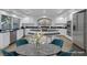 Stylized kitchen boasts a black granite island, stainless appliances, and dining area at 11158 Antonine Wall Ct, Las Vegas, NV 89141