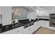 Bright kitchen showcases stainless steel gas cooktop, white cabinets, and granite counters at 11158 Antonine Wall Ct, Las Vegas, NV 89141