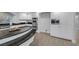 Bright kitchen features dark granite countertops, stainless steel appliances, and white cabinetry at 11158 Antonine Wall Ct, Las Vegas, NV 89141