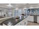 Bright kitchen with an island, stainless appliances, and a view into the living room at 11158 Antonine Wall Ct, Las Vegas, NV 89141