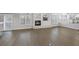 An open-concept living space features neutral walls and hardwood floors with great natural lighting at 11158 Antonine Wall Ct, Las Vegas, NV 89141