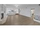 Spacious living area with wood floors, fireplace and a view into the kitchen area at 11158 Antonine Wall Ct, Las Vegas, NV 89141