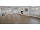 Open living area featuring wood-look floors, fireplace, and views of the bar area at 11158 Antonine Wall Ct, Las Vegas, NV 89141