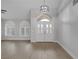 Bright living room featuring a high ceiling, arch window, and tiled floors at 11158 Antonine Wall Ct, Las Vegas, NV 89141
