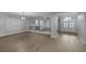 Bright open living room featuring vaulted ceilings, wood floors, and natural light at 11158 Antonine Wall Ct, Las Vegas, NV 89141