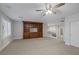 Spacious carpeted living room with custom built-ins and staircase access, perfect for entertaining at 11158 Antonine Wall Ct, Las Vegas, NV 89141
