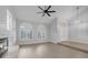 Light-filled living room showcases fireplace and arch window details at 11158 Antonine Wall Ct, Las Vegas, NV 89141