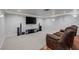 Living room features a large TV, surround sound, and recessed ceiling lights at 11158 Antonine Wall Ct, Las Vegas, NV 89141