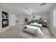 Staged bedroom features a cozy fireplace, plush bedding, and elegant decor for a relaxing retreat at 11158 Antonine Wall Ct, Las Vegas, NV 89141