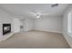 Spacious carpeted bedroom features a fireplace, bright windows, and ample room for relaxation at 11158 Antonine Wall Ct, Las Vegas, NV 89141