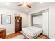 Bedroom featuring hardwood floors, bookcase, and murphy bed extended at 11398 Belmont Lake Dr # 104, Las Vegas, NV 89135