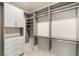 Spacious walk-in closet with custom shelving and drawers at 11398 Belmont Lake Dr # 104, Las Vegas, NV 89135