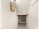 An organized closet space featuring neutral walls, shelf and hanging rack at 11398 Belmont Lake Dr # 104, Las Vegas, NV 89135
