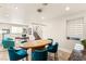 Dining area with contemporary table, stylish chairs, and view into living spaces creates an inviting atmosphere at 11398 Belmont Lake Dr # 104, Las Vegas, NV 89135