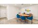 Dining area showcases modern decor, ample natural light, and seamless transition to other living spaces for gatherings at 11398 Belmont Lake Dr # 104, Las Vegas, NV 89135
