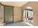 Inviting entryway with a decorative metal gate and access to an outdoor seating area at 11398 Belmont Lake Dr # 104, Las Vegas, NV 89135