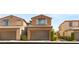 Charming two-story house featuring a two-car garage, neutral stucco and shutters at 11398 Belmont Lake Dr # 104, Las Vegas, NV 89135