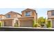 Charming two-story home with a well-maintained front yard and attached two car garage at 11398 Belmont Lake Dr # 104, Las Vegas, NV 89135