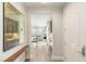 Welcoming foyer with an art display and an open view to the kitchen and living area at 11398 Belmont Lake Dr # 104, Las Vegas, NV 89135