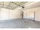 Spacious garage with epoxy flooring, providing ample storage and parking space at 11398 Belmont Lake Dr # 104, Las Vegas, NV 89135