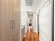 Bright hallway with hardwood floors and modern barn door at 11398 Belmont Lake Dr # 104, Las Vegas, NV 89135
