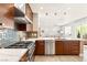 Contemporary kitchen featuring stainless steel appliances and an open design leading to the living room at 11398 Belmont Lake Dr # 104, Las Vegas, NV 89135