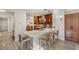 Modern kitchen features a large island with seating and stainless steel appliances at 11398 Belmont Lake Dr # 104, Las Vegas, NV 89135