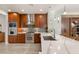 Gourmet kitchen boasts stainless steel appliances, tiled backsplash, and sleek cabinetry at 11398 Belmont Lake Dr # 104, Las Vegas, NV 89135