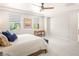 Spacious main bedroom with plush carpet, ceiling fan and two windows at 11398 Belmont Lake Dr # 104, Las Vegas, NV 89135
