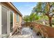 Outdoor patio area with seating, barbecue, and green trees at 11398 Belmont Lake Dr # 104, Las Vegas, NV 89135