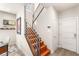 Modern wood staircase with sleek metal railing and plenty of natural light at 11398 Belmont Lake Dr # 104, Las Vegas, NV 89135