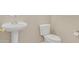 Functional half bathroom featuring a pedestal sink and standard toilet at 11934 Wild Chamomile St, Las Vegas, NV 89183