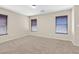 Bedroom with neutral carpet, 3 windows with blinds, and ample natural light at 11934 Wild Chamomile St, Las Vegas, NV 89183