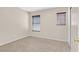 This bedroom has neutral paint and carpet, dual windows, and a closet at 11934 Wild Chamomile St, Las Vegas, NV 89183