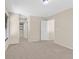This bedroom has neutral paint and carpet and windows at 11934 Wild Chamomile St, Las Vegas, NV 89183